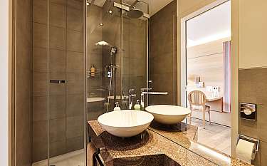 Elegant bathroom with shower and double sink.