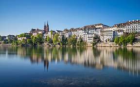 Panoramic view of the city of Basel with reflecting water.